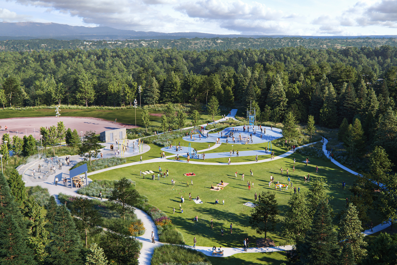 Aerial view of public park with people enjoying the playground, splash pad and lawn area